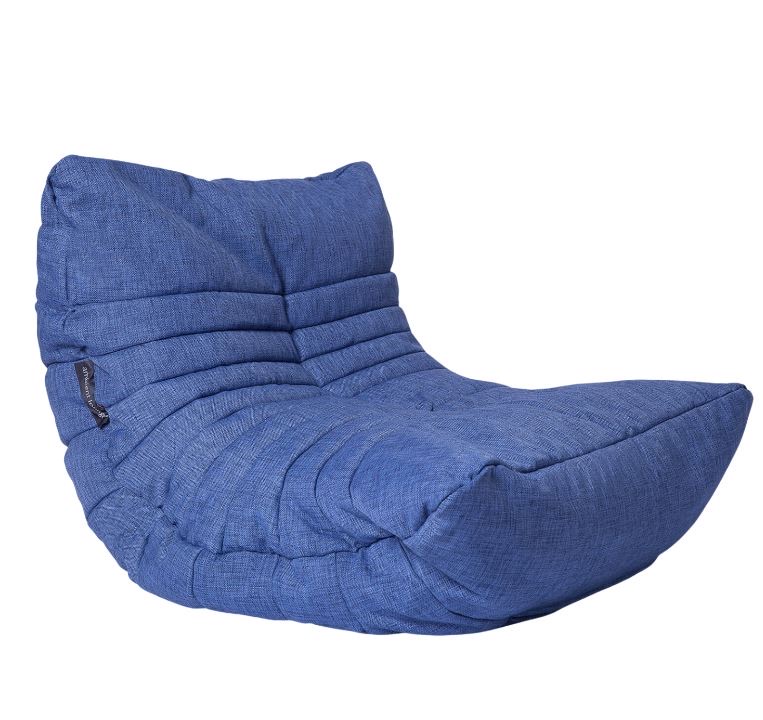 A modern, blue fabric floor chair with a cushioned, segmented design and an angled backrest for support.