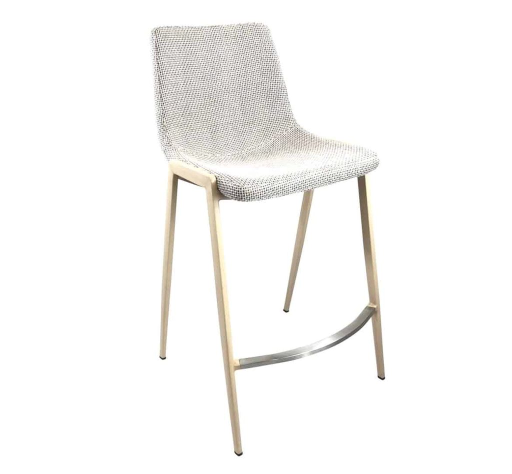 A modern bar stool with a light textured fabric seat, angled backrest, wooden legs, and a metal footrest.