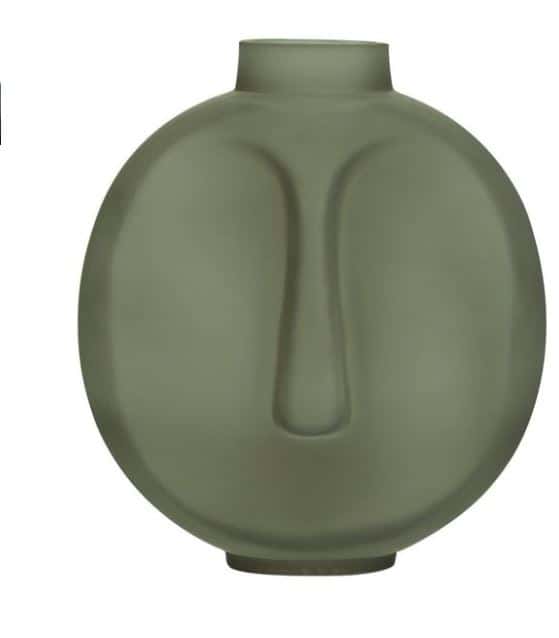 Matte green vase with a rounded shape and abstract facial features, including a raised nose and eye contours.