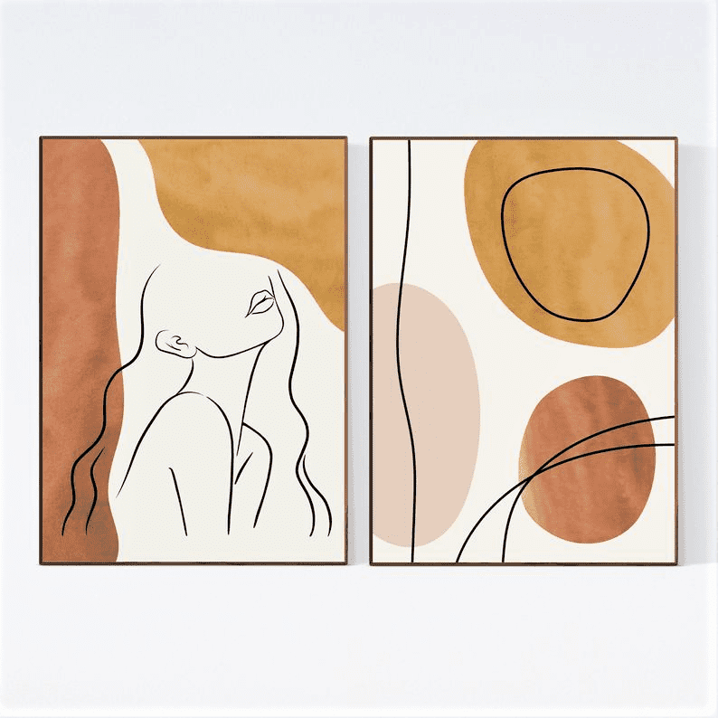 Two framed abstract art prints: one features a minimalist line drawing of a woman, the other has overlapping organic shapes in brown, beige, and ochre tones. Both hang on a white wall.